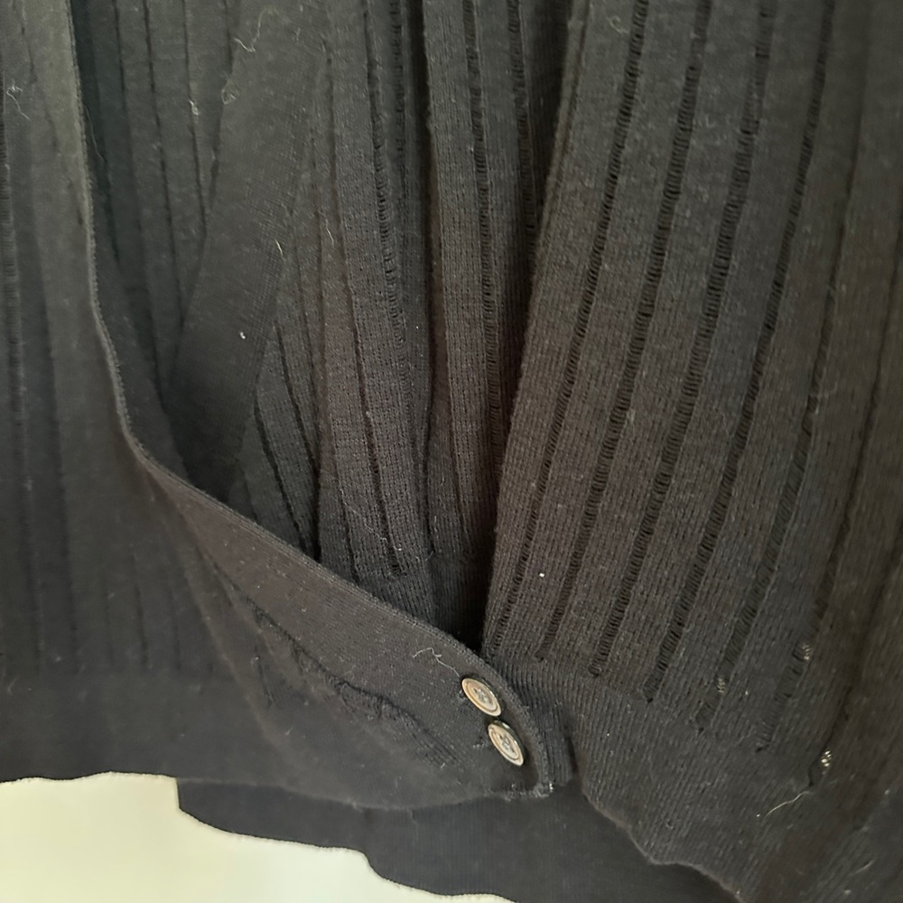 Lightweight sweater with button detail and striping.
